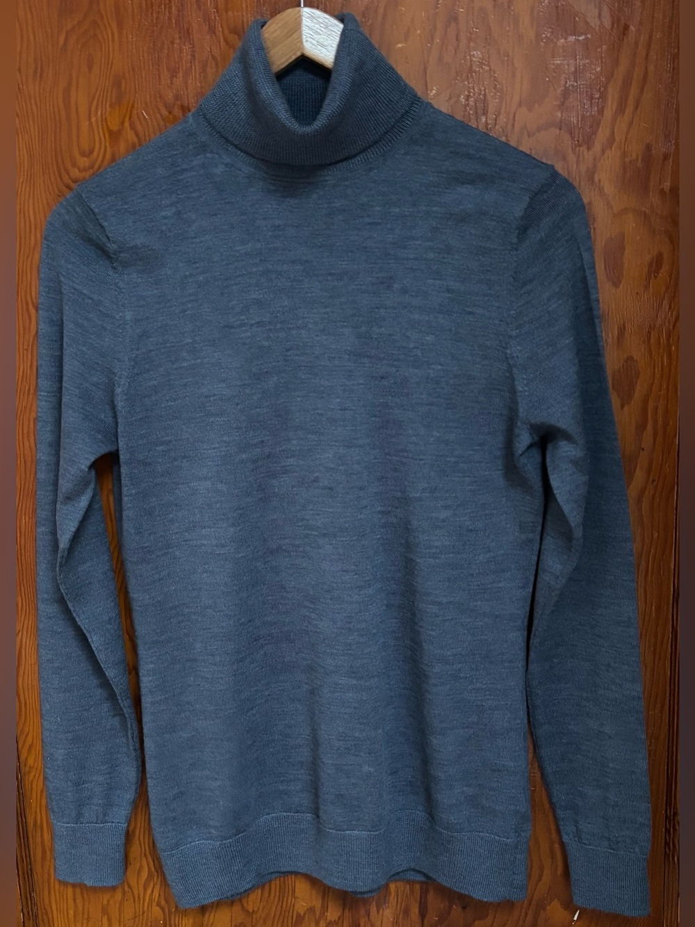 En Thread merino wool turtleneck sweater.